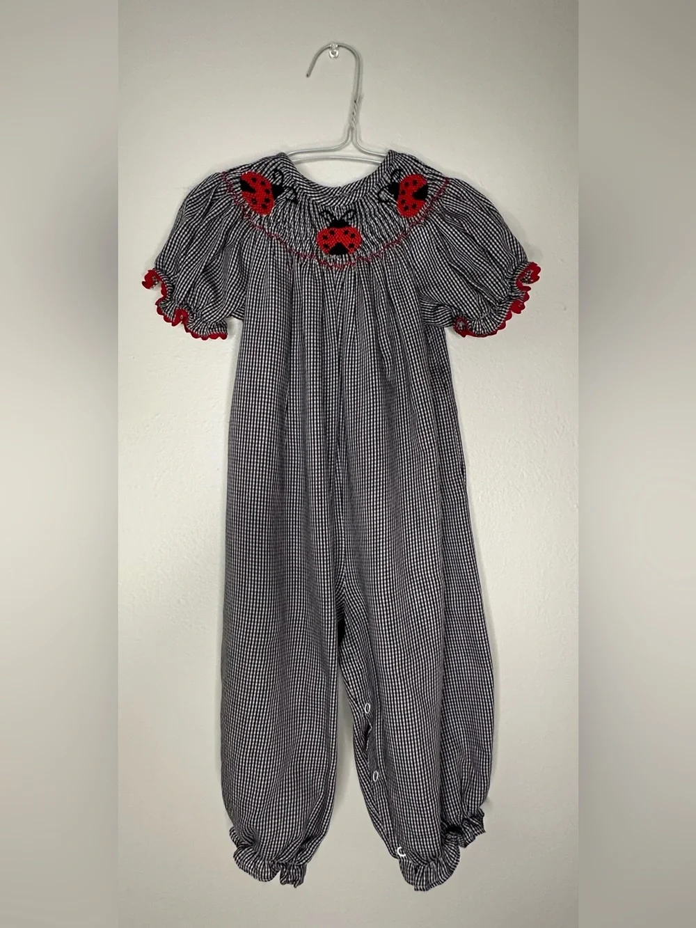 Smockadot Kids 9 month size with ladybug smocking with snap crotch .